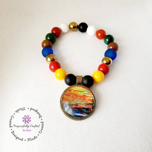 Multicolored Beaded Bracelet with a Fabric Charm. - Purposefully Crafted By Koko